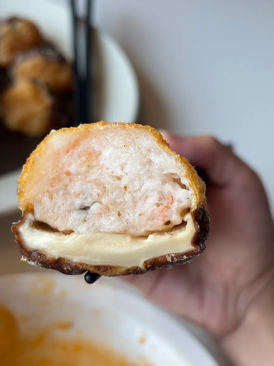 Cross-section of the shrimp filling inside the fried pyogosha