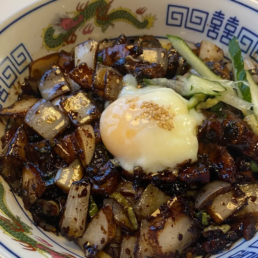 Poached-egg ganjajang served in a dragon-patterned bowl