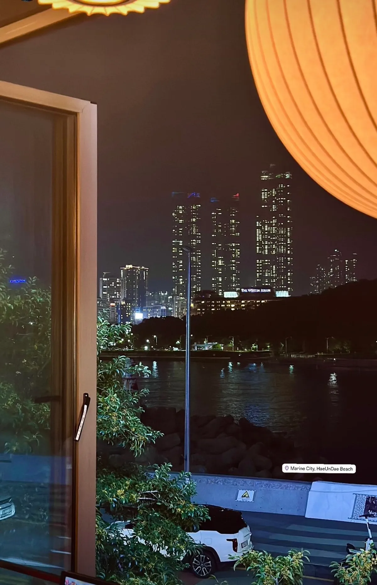 Window sofa seats with a view of Dongbaek Island's ocean