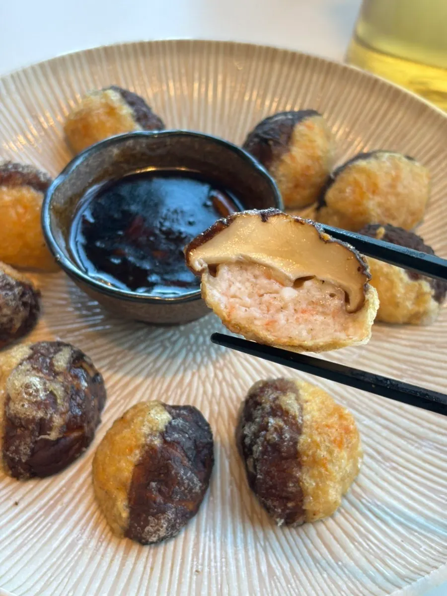 Plate of pyogosha served with black vinegar sauce