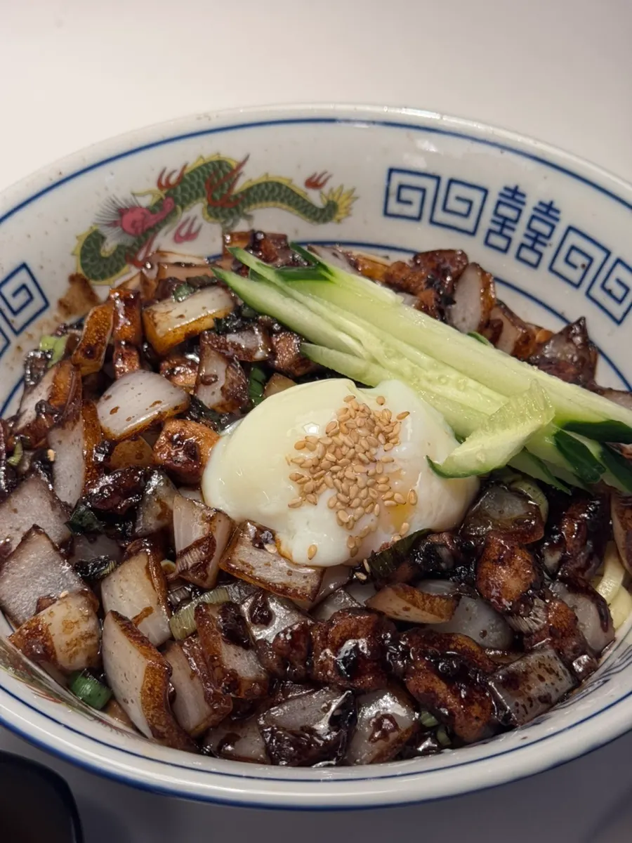 Jjajang noodles with a burst poached egg yolk