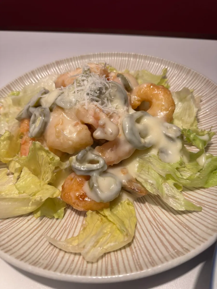 Cream shrimp topped with chopped jalapeño