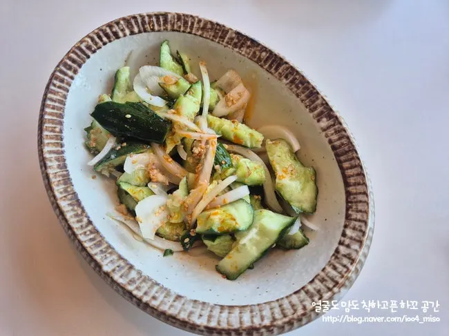 A plate of paihuanggua smashed cucumber salad