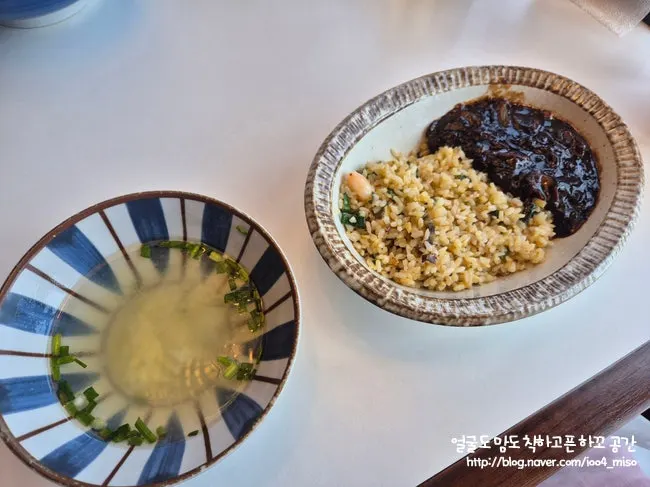 Egg drop soup served alongside abalone shrimp fried rice