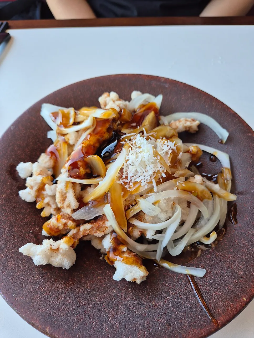 Black vinegar pork tangsuyuk topped with coconut powder