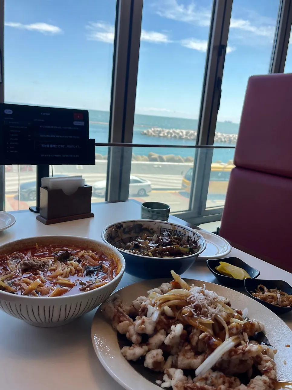 A full Chinese meal spread on the window table