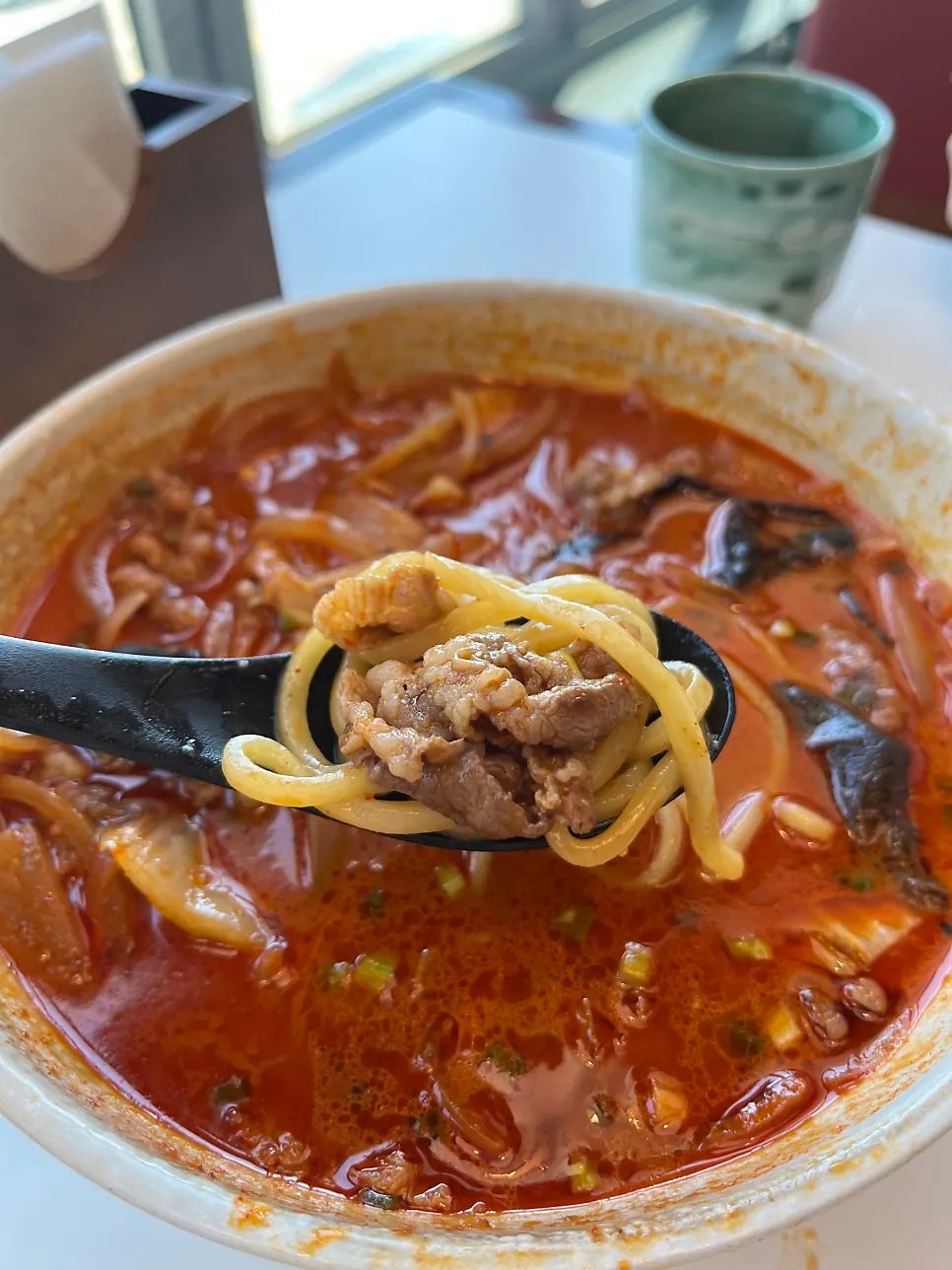 Jjamppong broth and noodles topped with woo-samgyeop beef