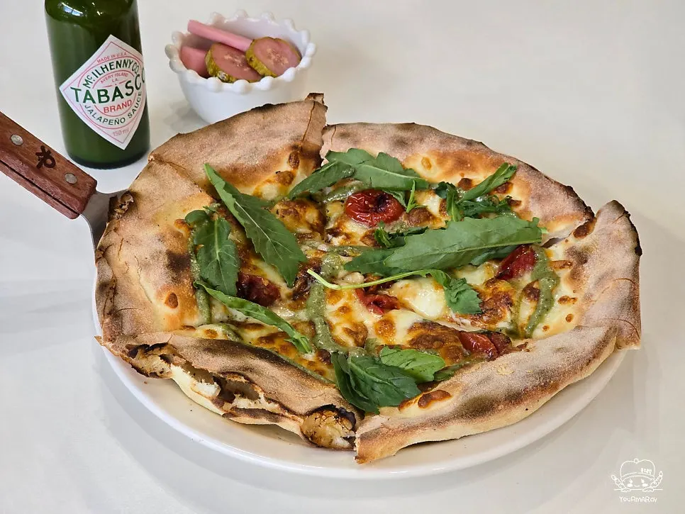 Basil margherita pizza with golden crust