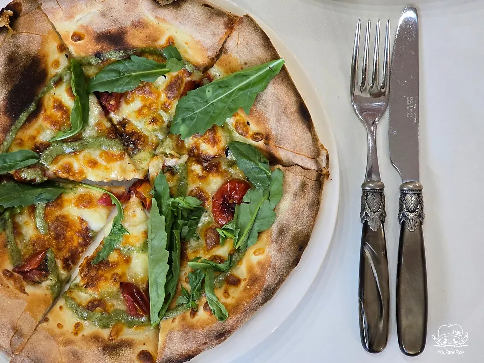 Pizza paired with salad at a Namyangsan Station favorite
