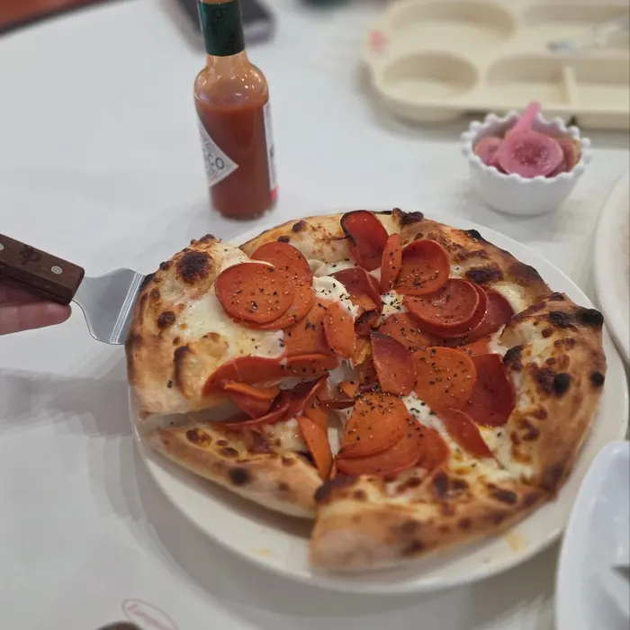 The pepperoni pizza, served first