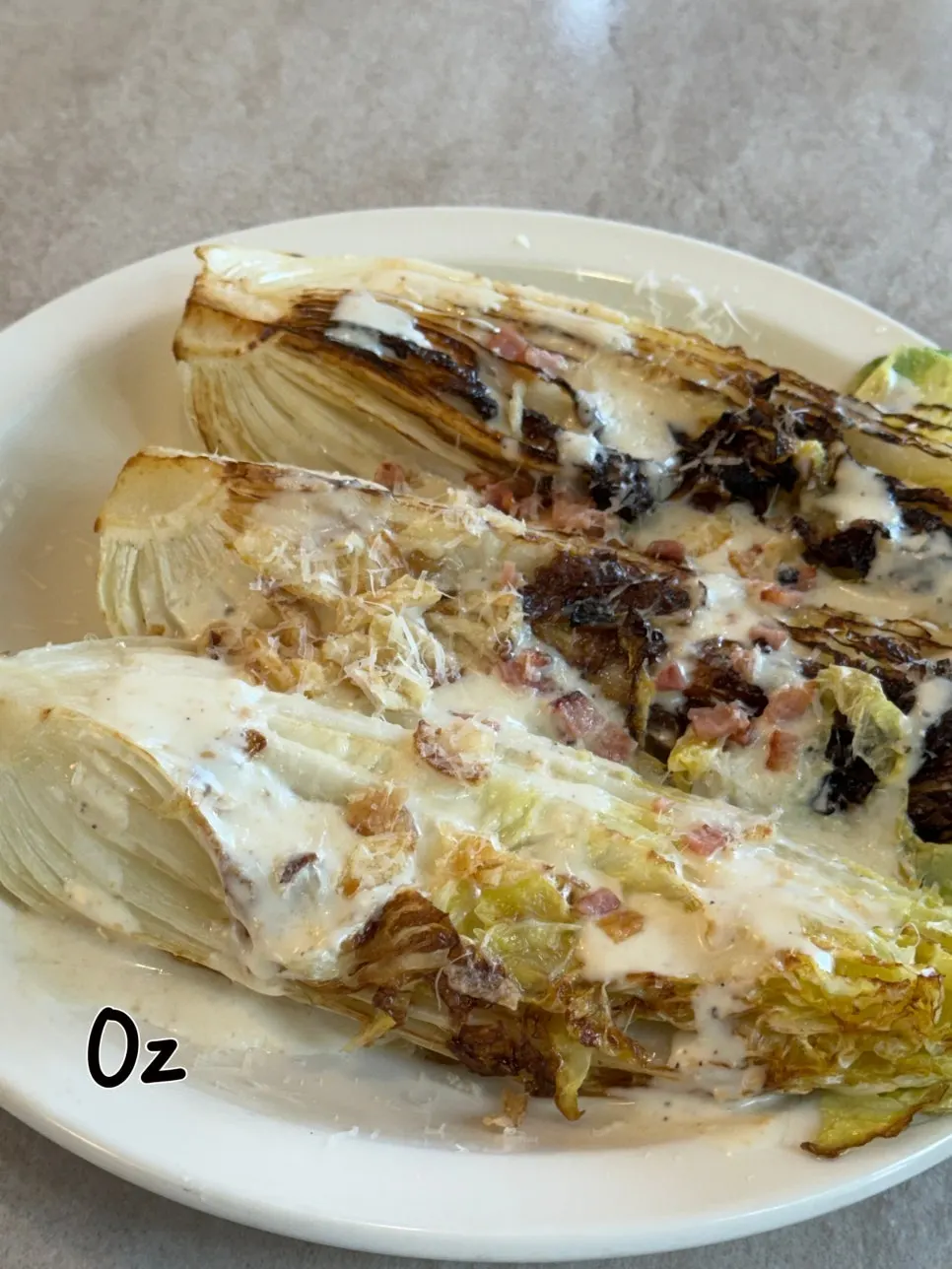 A plate of Bueokgan's romaine Caesar salad