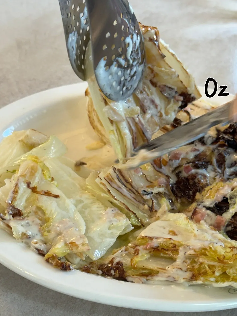 Close-up of romaine Caesar salad with dressing