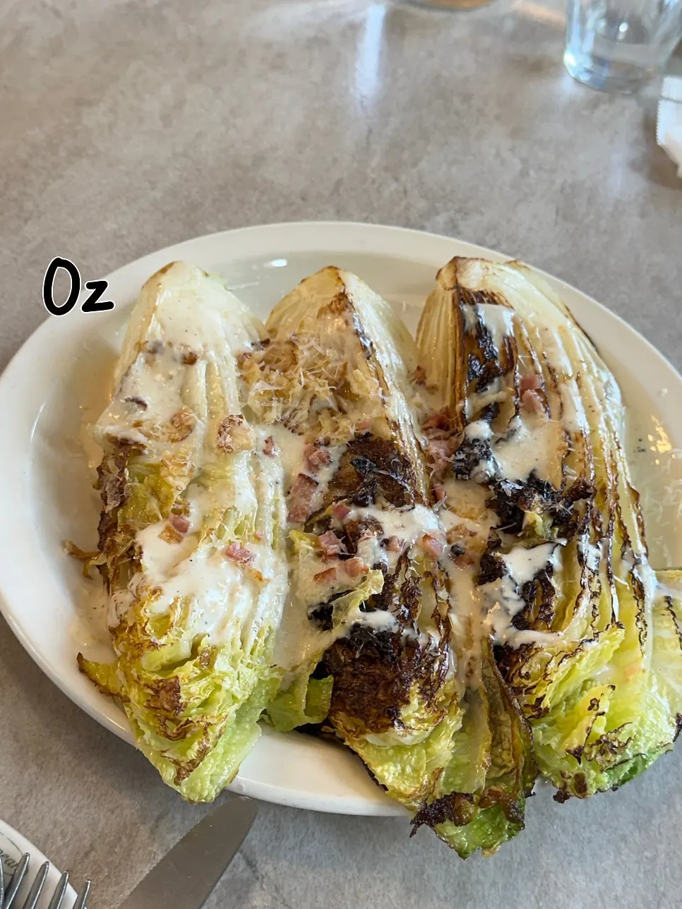 A generous portion of romaine Caesar salad