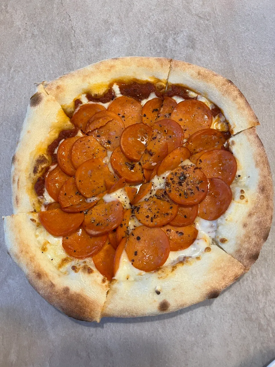 Wood-fired pepperoni pizza
