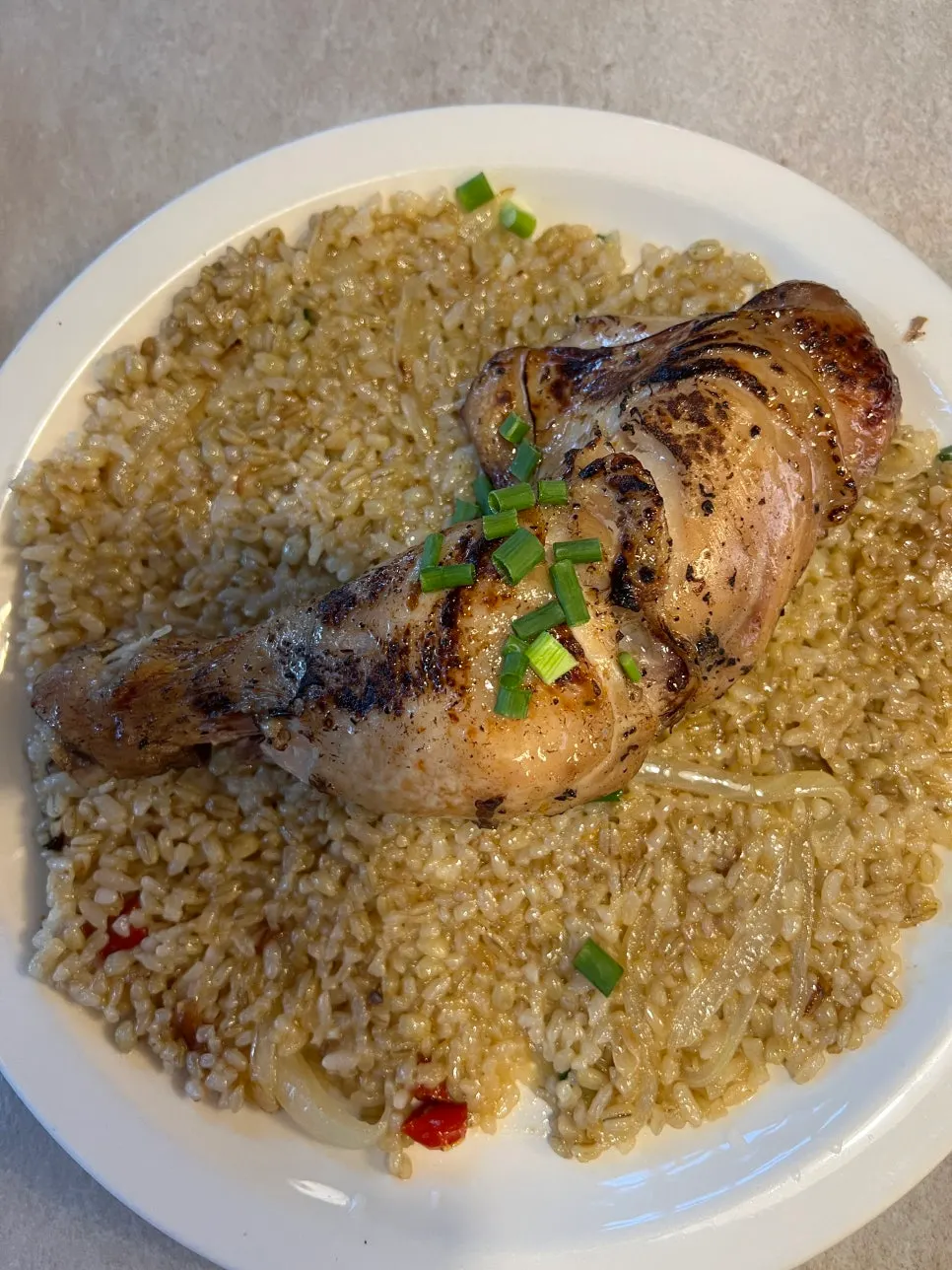 Kung Pao chicken pilaf topped with oven-roasted chicken