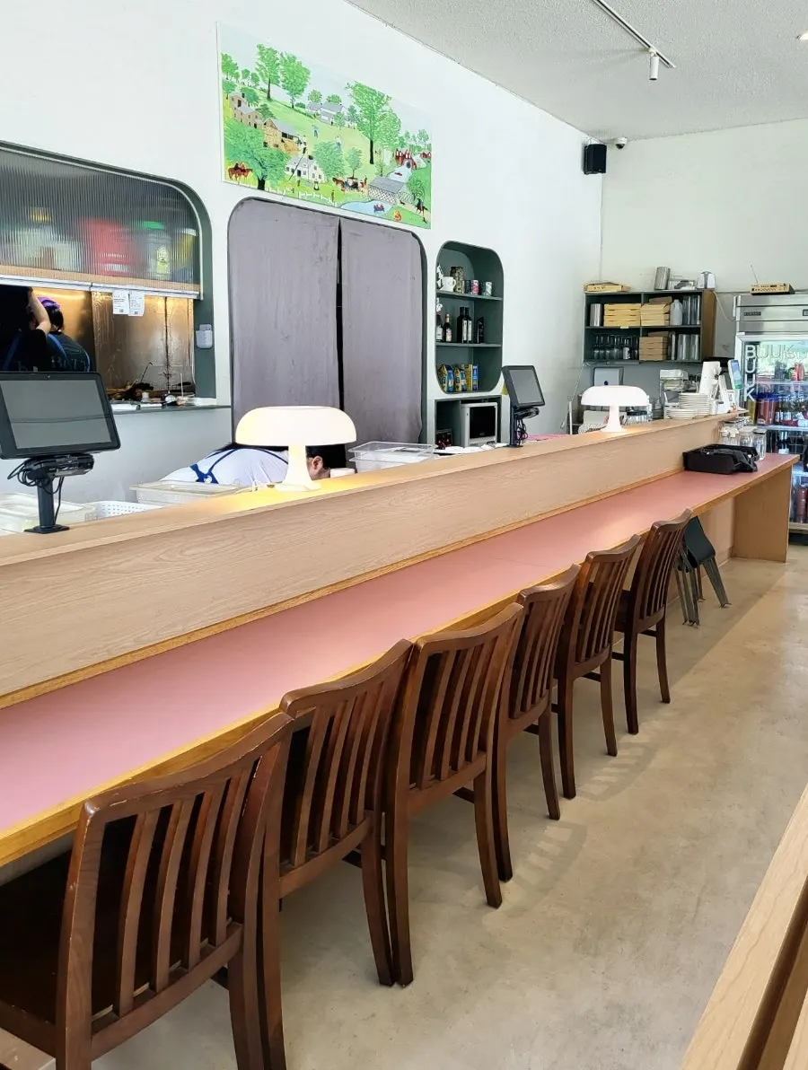 Dining hall with large windows at Bueokgan Suwan Branch