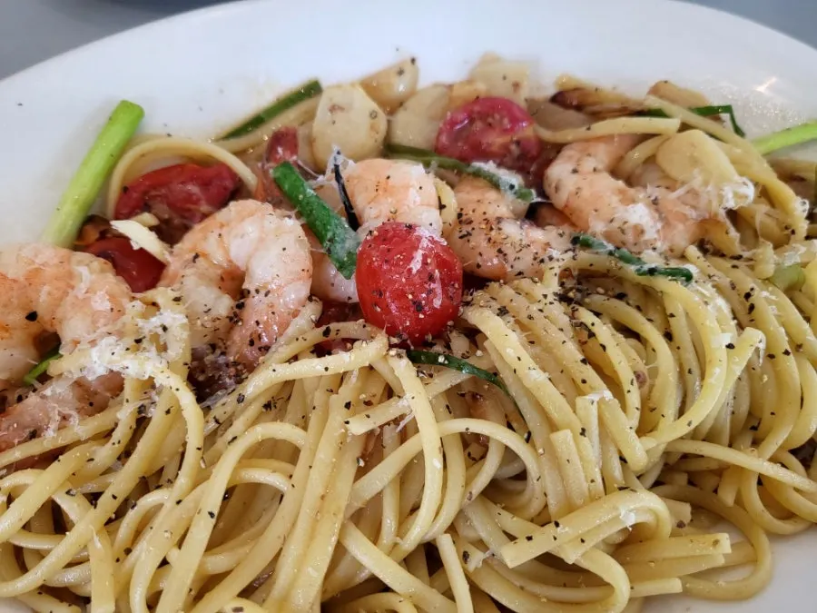Oil pasta topped with plump shrimp