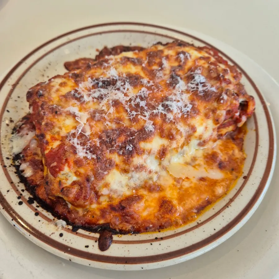Oven-baked lasagna covered in cheese