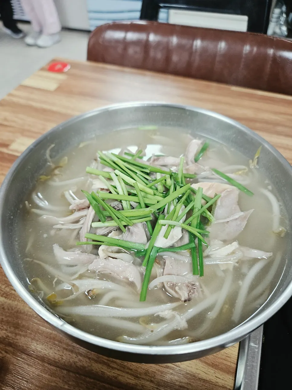 Bowl of dakgomtang with clear, milky broth