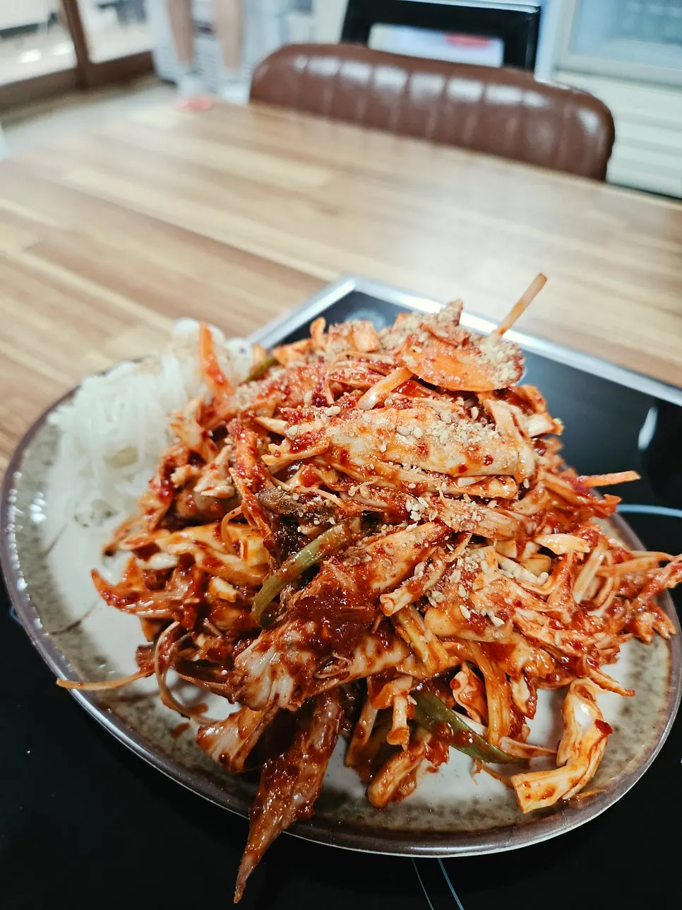 Plate of chicken muchim served with thin noodles