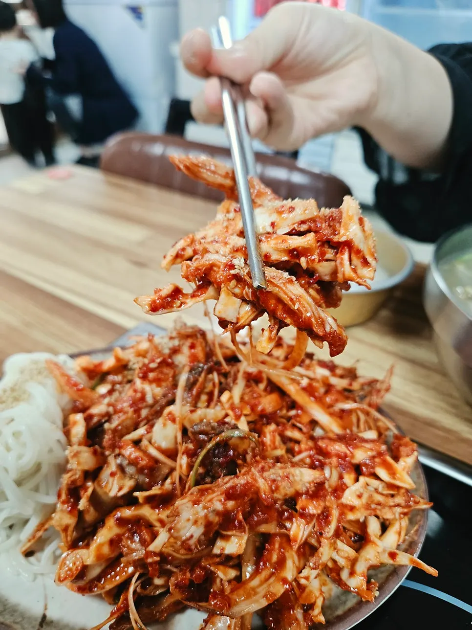 Close-up of the spicy-tangy sauce on the chicken muchim