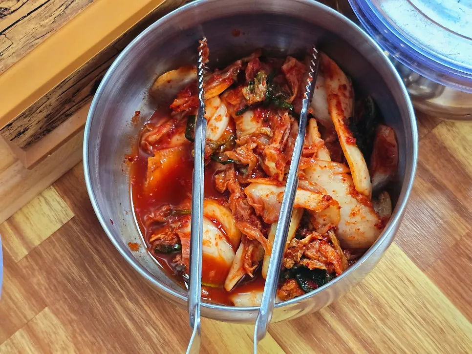 Diced radish kimchi and kimchi containers on every table