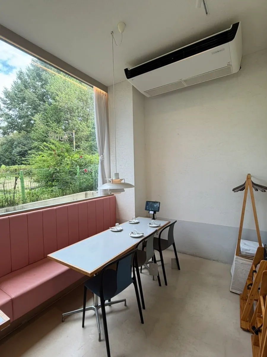 Full view of the dining hall with sofa and bar seats