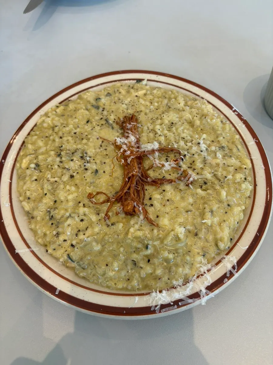 Oil pasta twirled around a fork