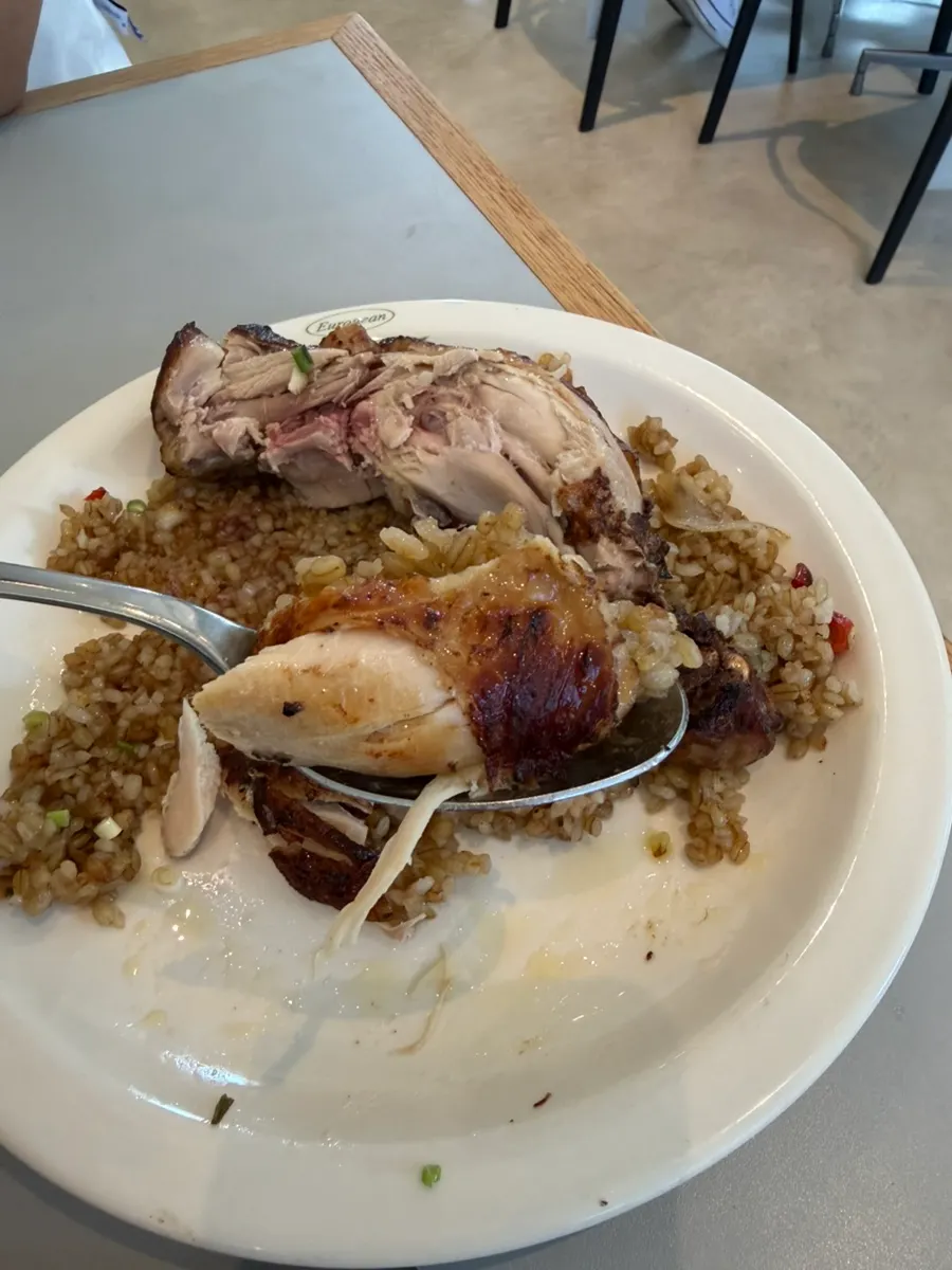 Chicken thigh meat placed on top of the pilaf