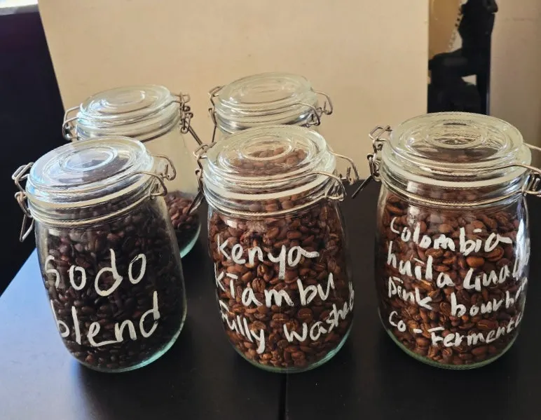 Liquor bottles and coffee beans lined up on a shelf