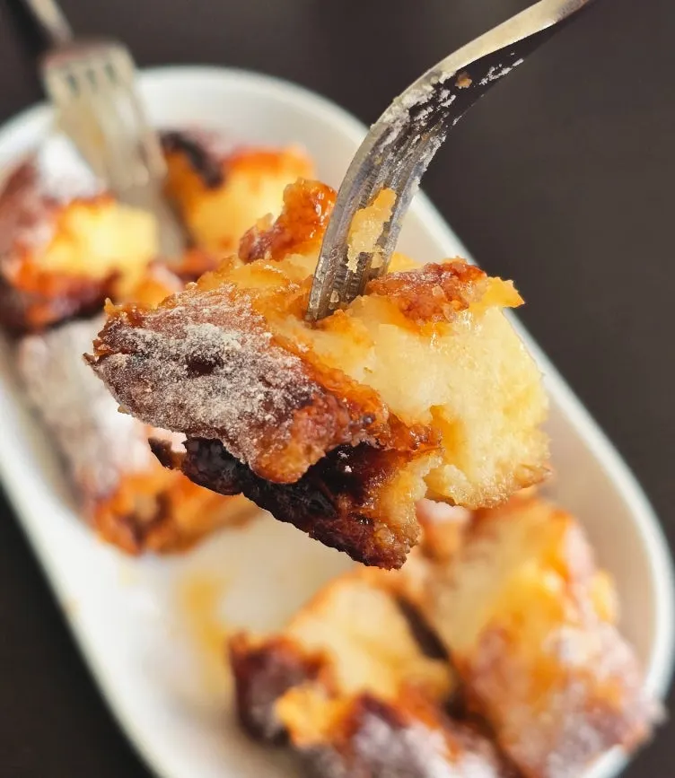 Fluffy inside of the French toast cut with a fork