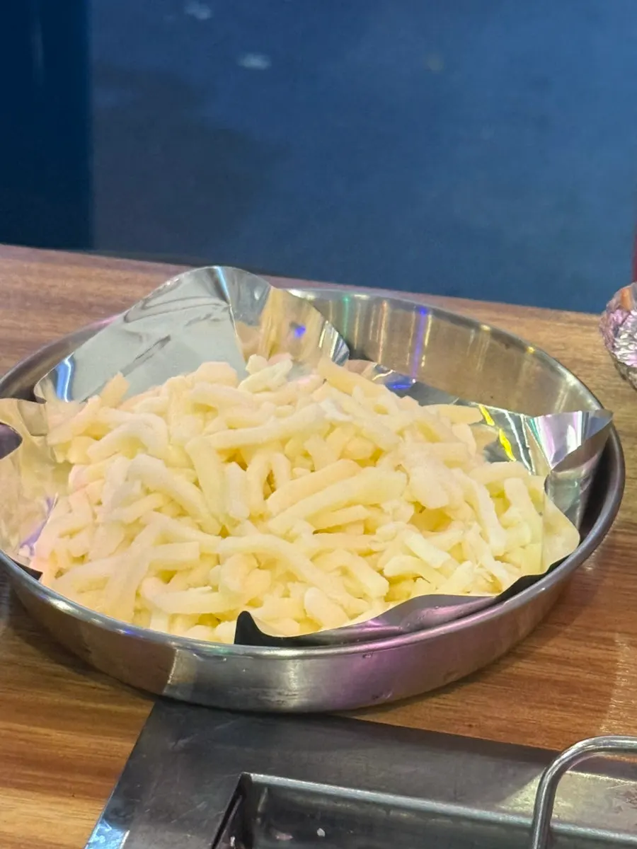 Clear clam soup in a metal pot