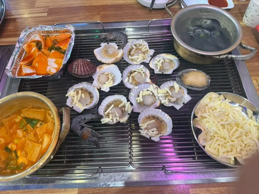 Grilled clam platter stacked on a three-tier tray