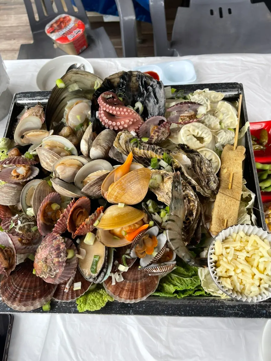 Clam steamer simmering outdoors during the daytime
