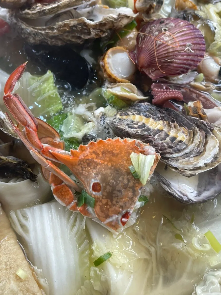 Plate of cooked clams removed from the pot