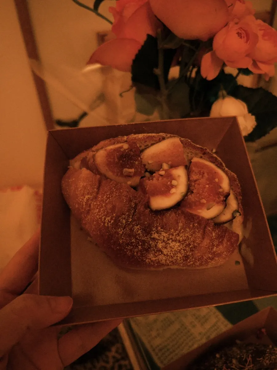 Cross-section of salt bread topped with fig and cream
