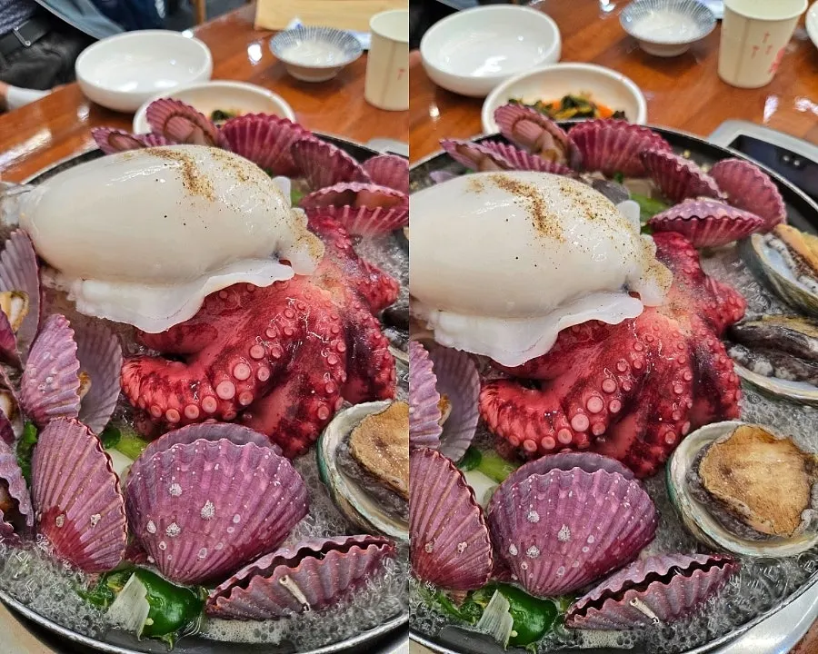 Medium-size whole octopus kalguksu piled high with seafood