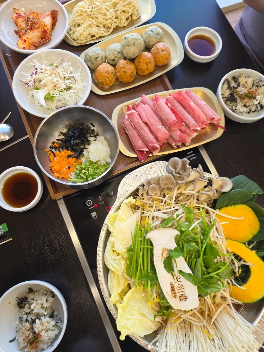 Full table setup of the rolled dumpling hot pot for three