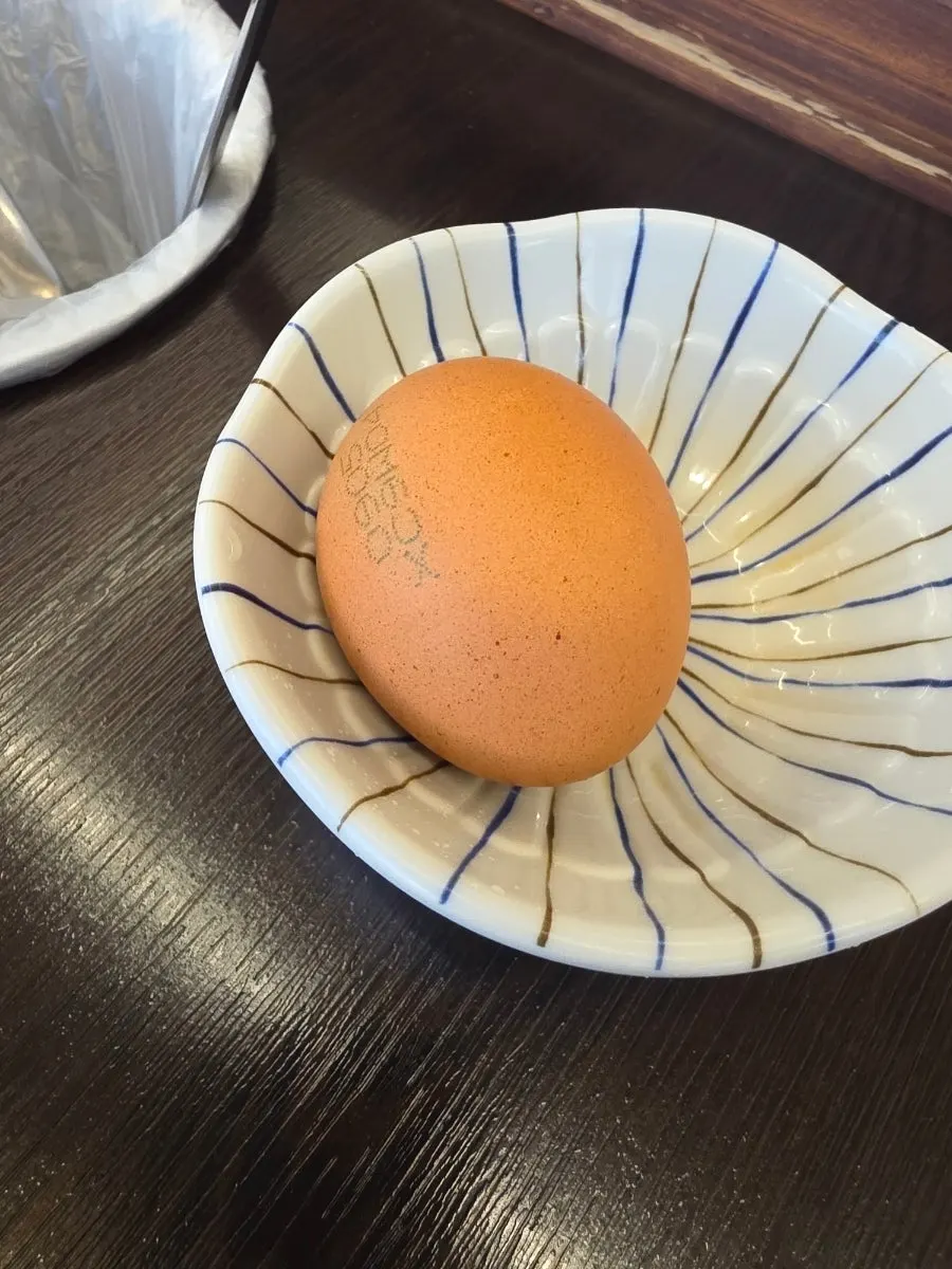 A bowl of porridge cooked in the hot pot broth