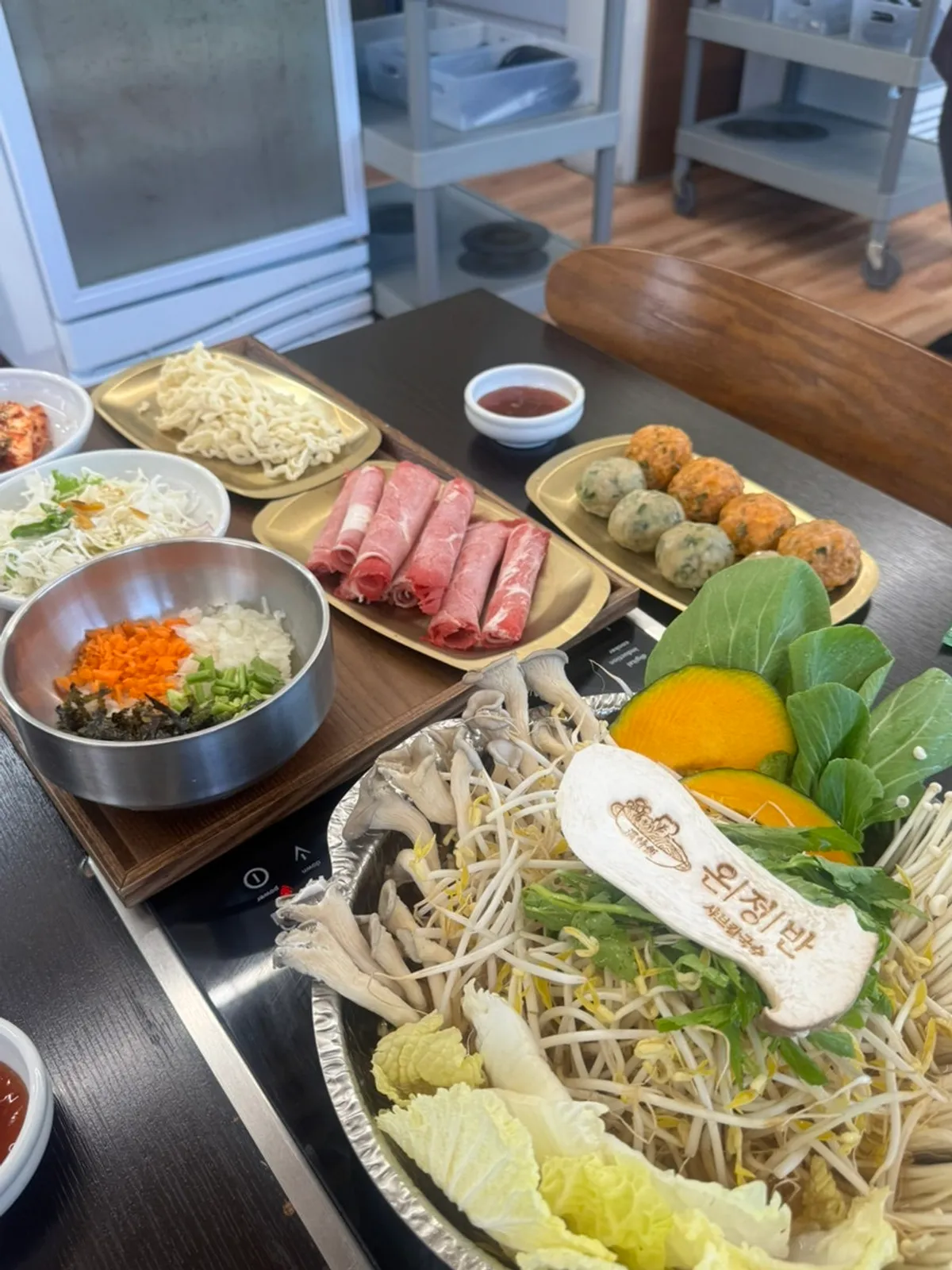Full table setup for two servings of clear-broth shabu kalguksu