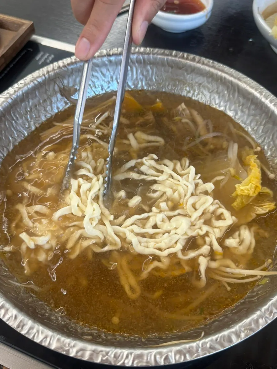 Meat and vegetables cooked in the now-richer broth