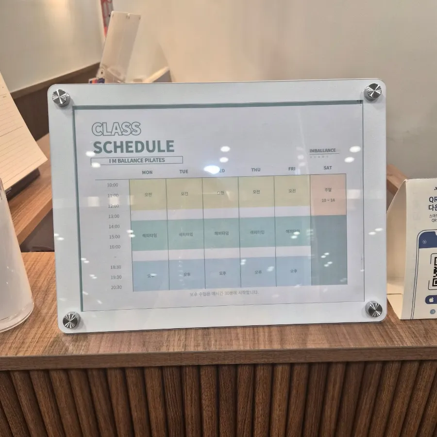 Class schedule board and event notice on the wall