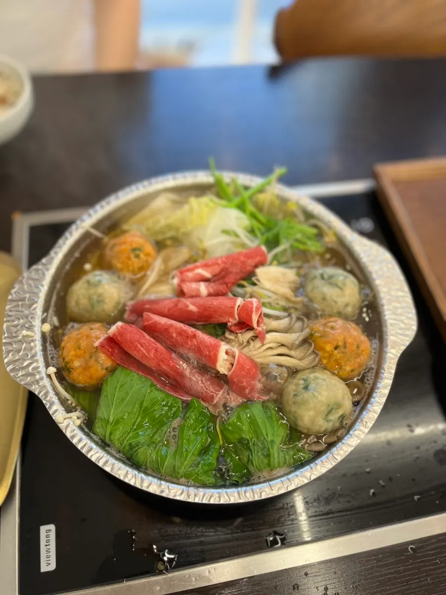 Pot of dumpling hot pot broth starting to boil