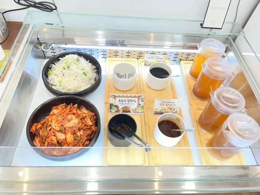 Self-serve corner with geotjeori, salad, and broth