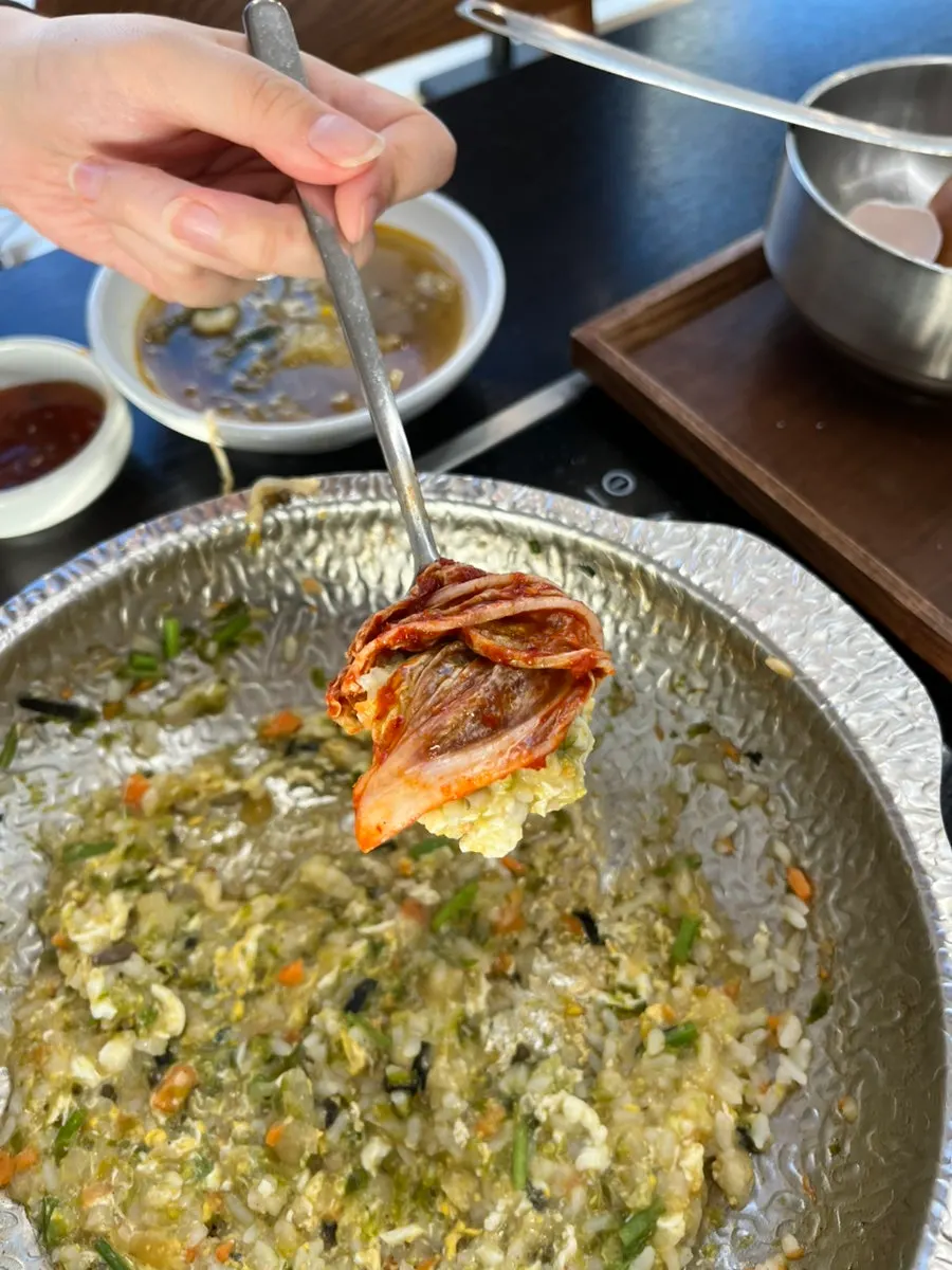Bowl of gondeure rice mixed with soy sauce and sesame oil