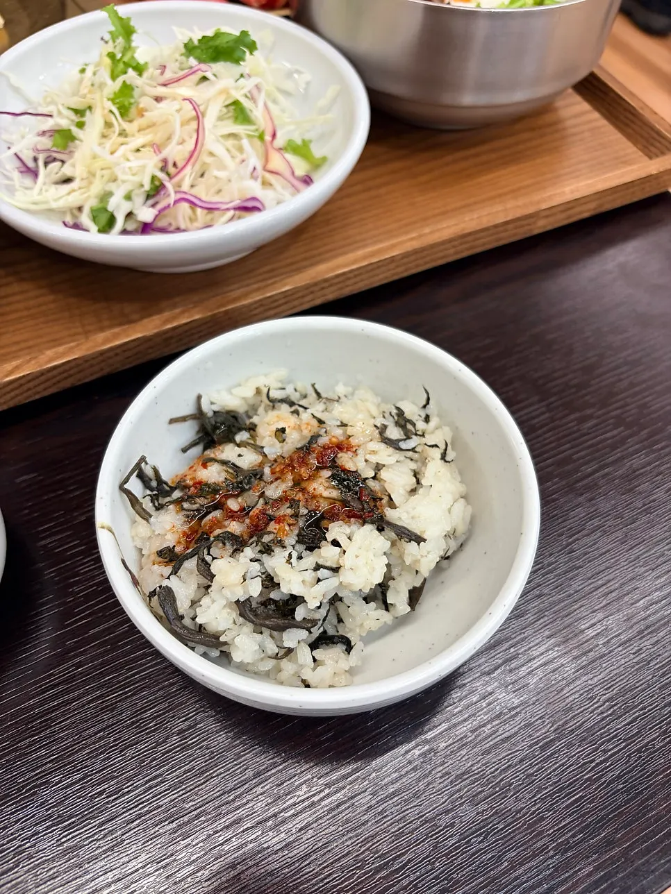 A bowl of gondeure rice mixed with sauce