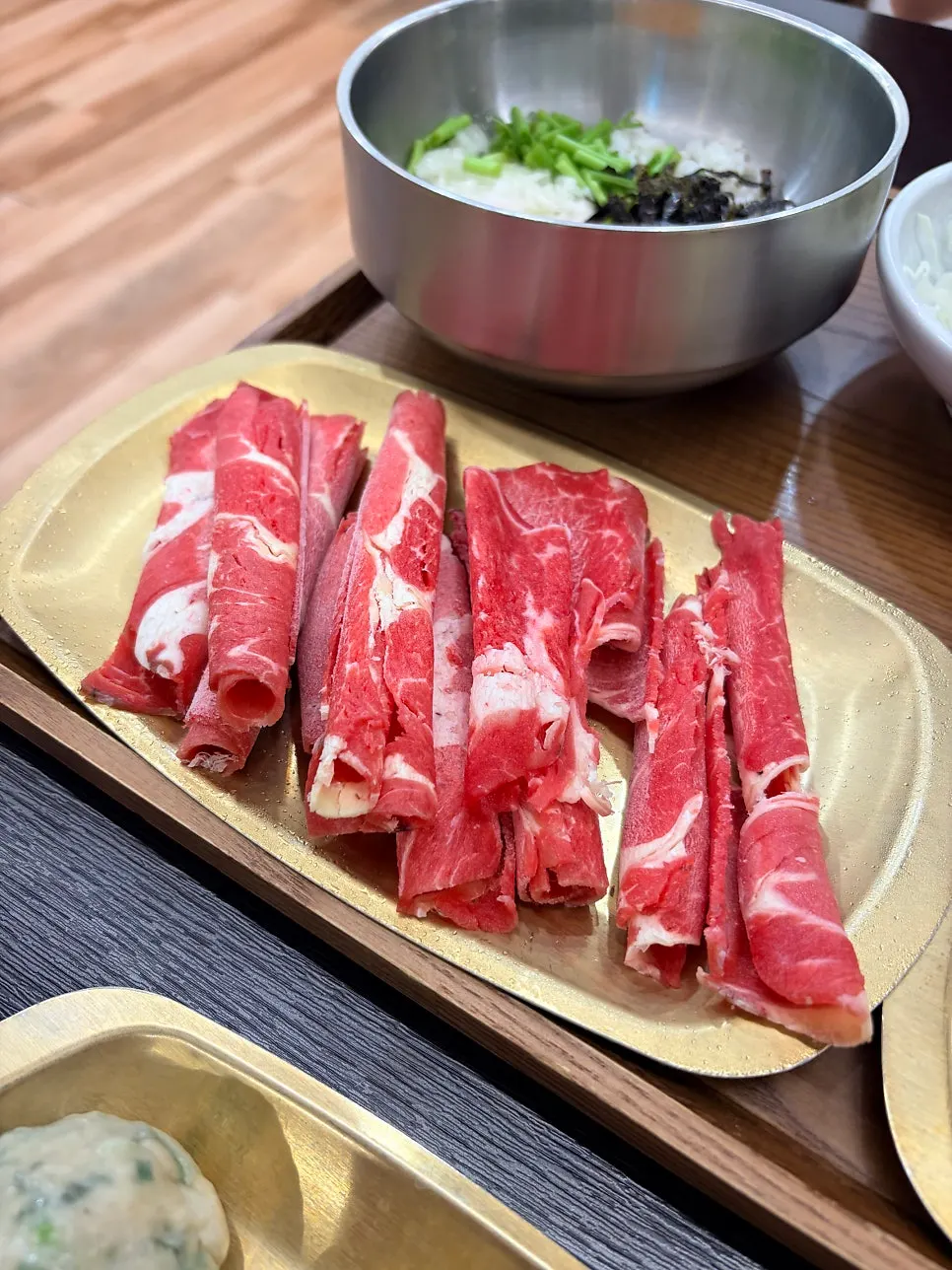 Hot pot filled with shabu-shabu meat and vegetables