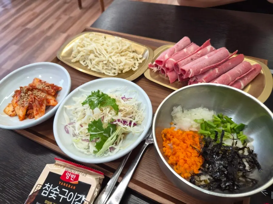 Table fully set with the shabu spread