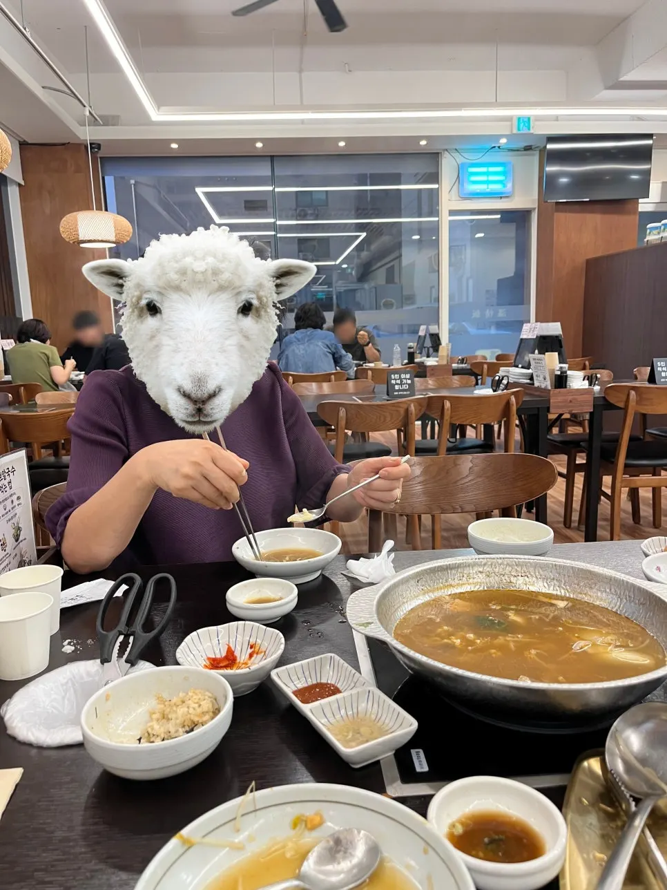 Springy kalguksu noodles lifted out of the pot