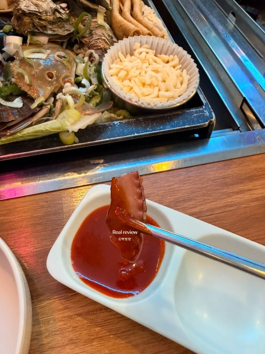 조개찜 위에 올린 치즈사리